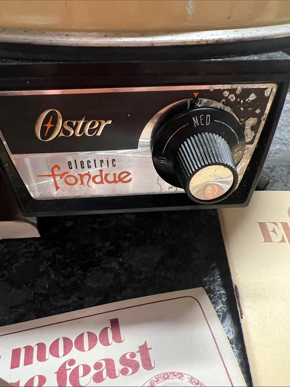 Vintage Oster MCM Harvest Gold Electric Fondue Set with Black Lid and Handle.